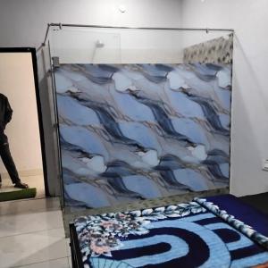 a wall with a painting of clouds at nyagaon swimming pool in Malaut