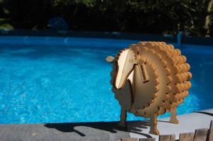 a statue of a turkey next to a swimming pool at Casavabene Appartamenti - for hikers, bikers and slow travelers in Murazzano +36 photos