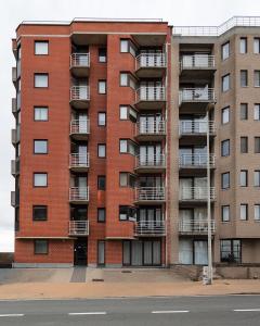 an apartment building on the side of a street at Ground floor sea view Raversijde Lets Go Getaways in Ostend