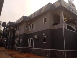 a black and white building with white windows at 517 VIP suites and apartments in Awka