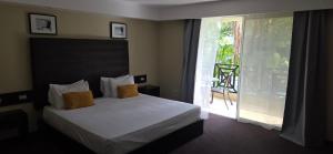 Postel nebo postele na pokoji v ubytování LTH Las Terrenas Hotel + 24 fotografií