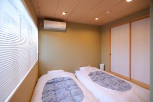 En eller flere senge i et værelse på 朱鷺ノ清101