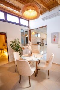 a dining room with a table and chairs at Umbi Chalet in Dahab +17 photos