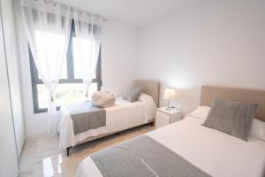 En eller flere senge i et værelse på B&B Benidorm Beach 13 - 38 + 7 billeder