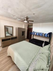 a bedroom with a bed and a ceiling fan at Corazón de Atlixco in Atlixco