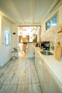 a kitchen with a sink and a counter top at Umbi Chalet in Dahab