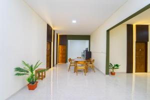a dining room with a table and chairs at Semenrante Living By ARBA in Solo