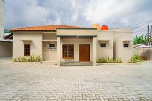 a small house with a brick driveway in front of it at Semenrante Living By ARBA in Solo