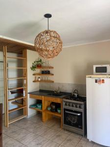 Kuchyň nebo kuchyňský kout v ubytování El despertar Hospedaje