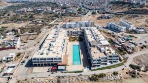 an aerial view of a building in a city at Cozy apartment adana in Aourir