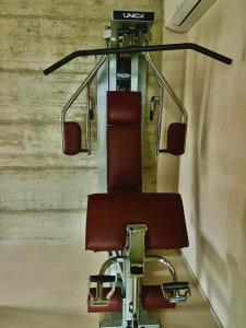 a red barber chair in a train station at PECORANERA in Bracciano