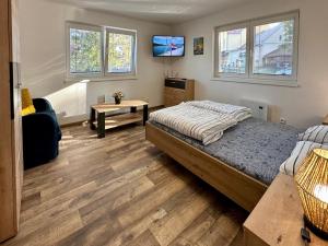 Ένα ή περισσότερα κρεβάτια σε δωμάτιο στο Rekreační dům Dobšín