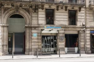 a building with two entrances to a store at Ilunion Almirante in Barcelona