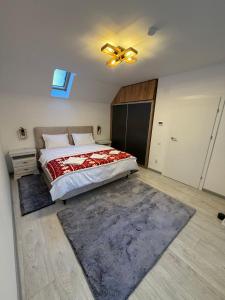 a bedroom with a bed and a ceiling fan at Casa Criss in Sinaia