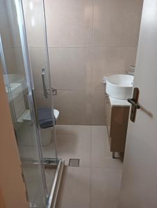 a bathroom with a shower and a sink at Urban Mountain House in Karpenision +56 photos