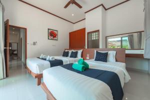 En eller flere senge i et værelse på Orchid Pool Villa 8 Rawai + 71 billeder