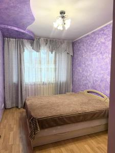 En eller flere senge i et værelse på Будинок в Мукачево