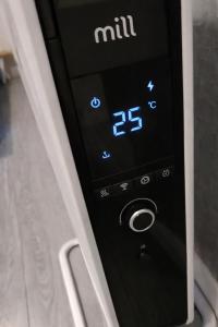 a close up of a remote control in a car at Studio Happy May in Sibiu