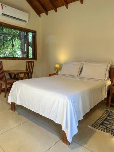 Postel nebo postele na pokoji v ubytování Chalé do Bosque + 29 fotografií