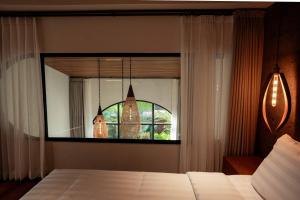 Ένα ή περισσότερα κρεβάτια σε δωμάτιο στο The Home Villas +24 φωτογραφίες