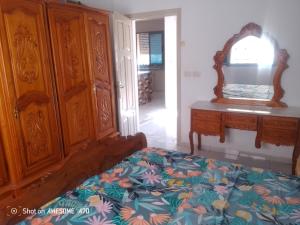 Un pat sau paturi într-o cameră la appartement 7 centre ville Midoun