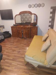 a room with a bed and a dresser at Siófok 7 Apartmanház in Siófok