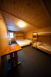 En eller flere senge i et værelse på Chata SKI Jezersko