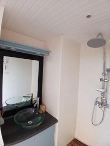a bathroom with a sink and a mirror at Aqua Lodge, Les Saintes, Terre de Haut, Guadeloupe in Terre-de-Haut +96 photos
