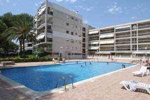 a large swimming pool in front of a building at For A Stay Cala Dorada in Salou