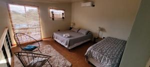 En eller flere senge i et værelse på La Sietecolores