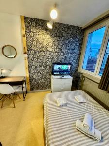 Ένα ή περισσότερα κρεβάτια σε δωμάτιο στο Hyper Centre de Valence - Studio 41