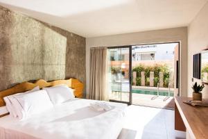 Postel nebo postele na pokoji v ubytování Pilot Amphora Boutique Hotel "Adults Only"