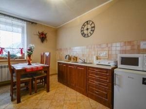 Kuchyň nebo kuchyňský kout v ubytování Apartament u Zosi