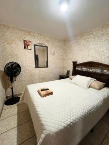 Ένα ή περισσότερα κρεβάτια σε δωμάτιο στο Cristales de Antigua Hotel Cristal