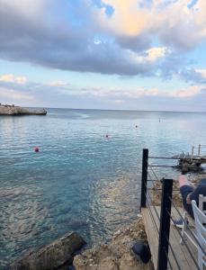 a view of the ocean from a pier at Kapparis Beach Escape, near beach, BBQ, free parking in Paralimni +28 photos
