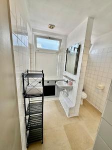 a bathroom with a toilet and a sink at Hyper Centre de Valence - Grand Studio 52 in Valence