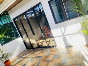 an open door of a house with plants at Corcovado Pura Vida Stays in Puerto Jiménez