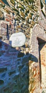 a frisbee is sitting on a stone wall at Torre del Tempo in Torgiano