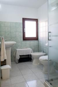 Et badeværelse på Appartamento Villa Barbara Sardinia