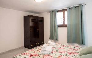 En eller flere senge i et værelse på Appartamento Villa Barbara Sardinia