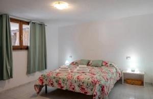 En eller flere senge i et værelse på Appartamento Villa Barbara Sardinia