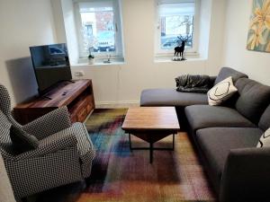 a living room with a couch and a coffee table at Südeifel Spangdahlem in Spangdahlem