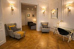 a living room with chairs and a couch at Sleephotels Alsterroom in Hamburg +93 photos