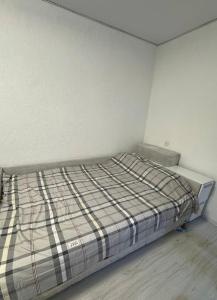 Ένα ή περισσότερα κρεβάτια σε δωμάτιο στο Apartament modern plaja Nistrului