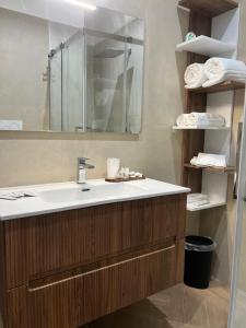 a bathroom with a sink and a mirror at 50 Passi dal Duomo in Marcianise +20 photos
