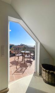 a view of a patio with a table and chairs at Penthouse Jul&Mel in Valle Gran Rey