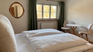 En eller flere senge i et værelse på Die Talstation