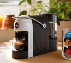 a coffee maker on a counter with a cup of coffee at La casetta rosa in Nicotera
