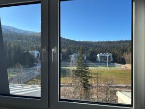 a window with a view of a park at Bjelašnica by Samke in Bjelašnica