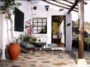 En terrasse eller udendørsområde på Casa Rural el Palmito, privater Pool